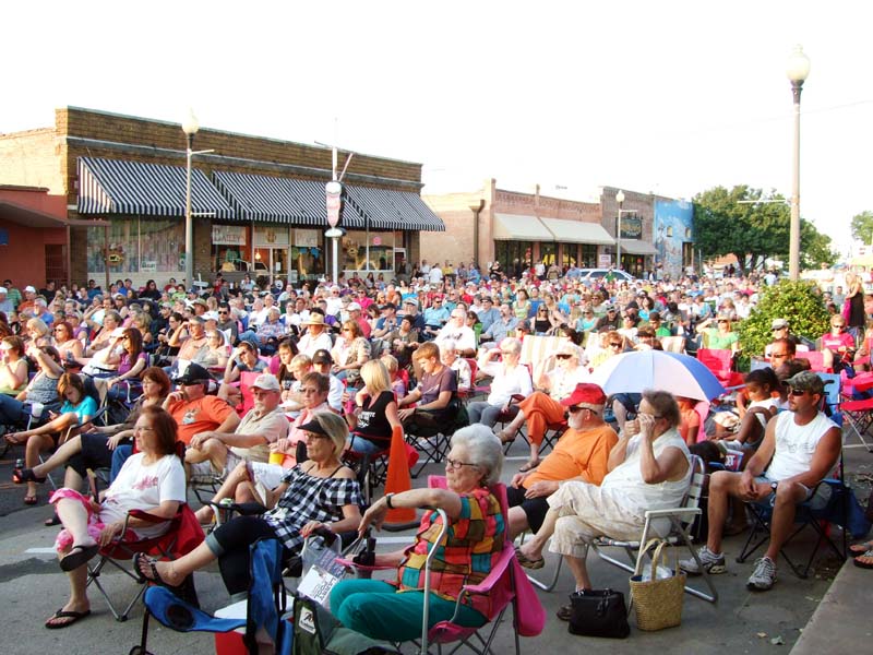 photo of crowd listening to band perform
